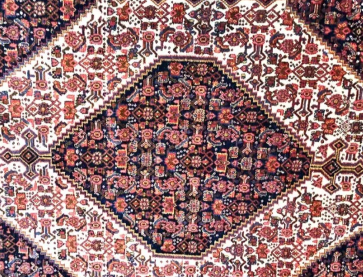 A Brilliant Antique Tribal Persian Seneh Rug
