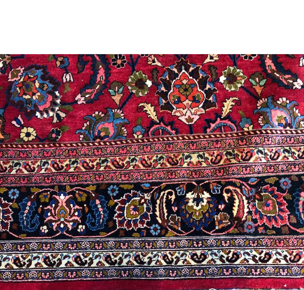 An Antique Palace Size Persian Mashad Rug