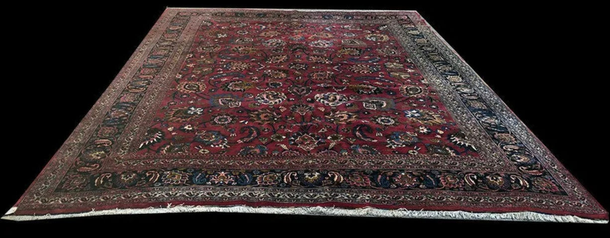 An Antique Palace Size Persian Mashad Rug