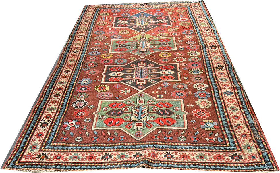 An Antique Decorative Geometric Tribal Caucasian Rug