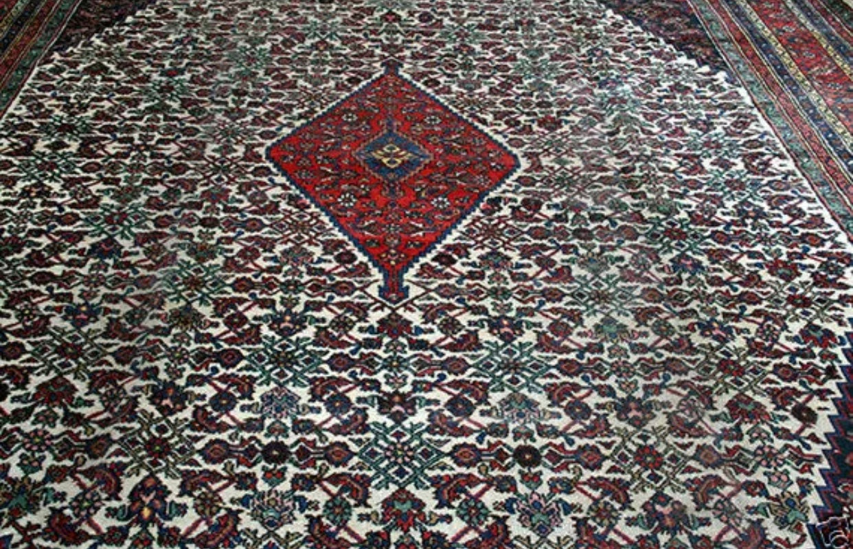 An Antique Palace Size 11’ x 19’ Persian Bibikabad Rug