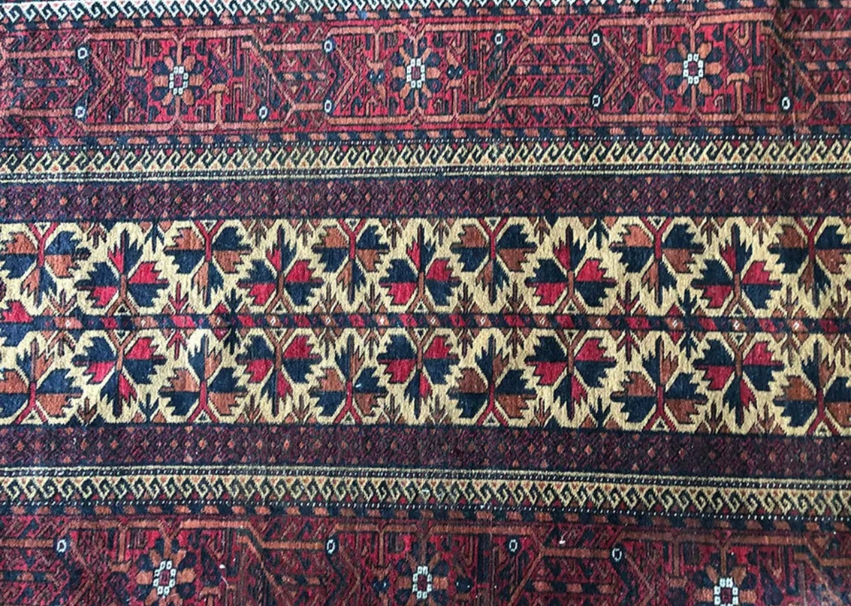 An Antique Primitive & Tribal Baluch Rug