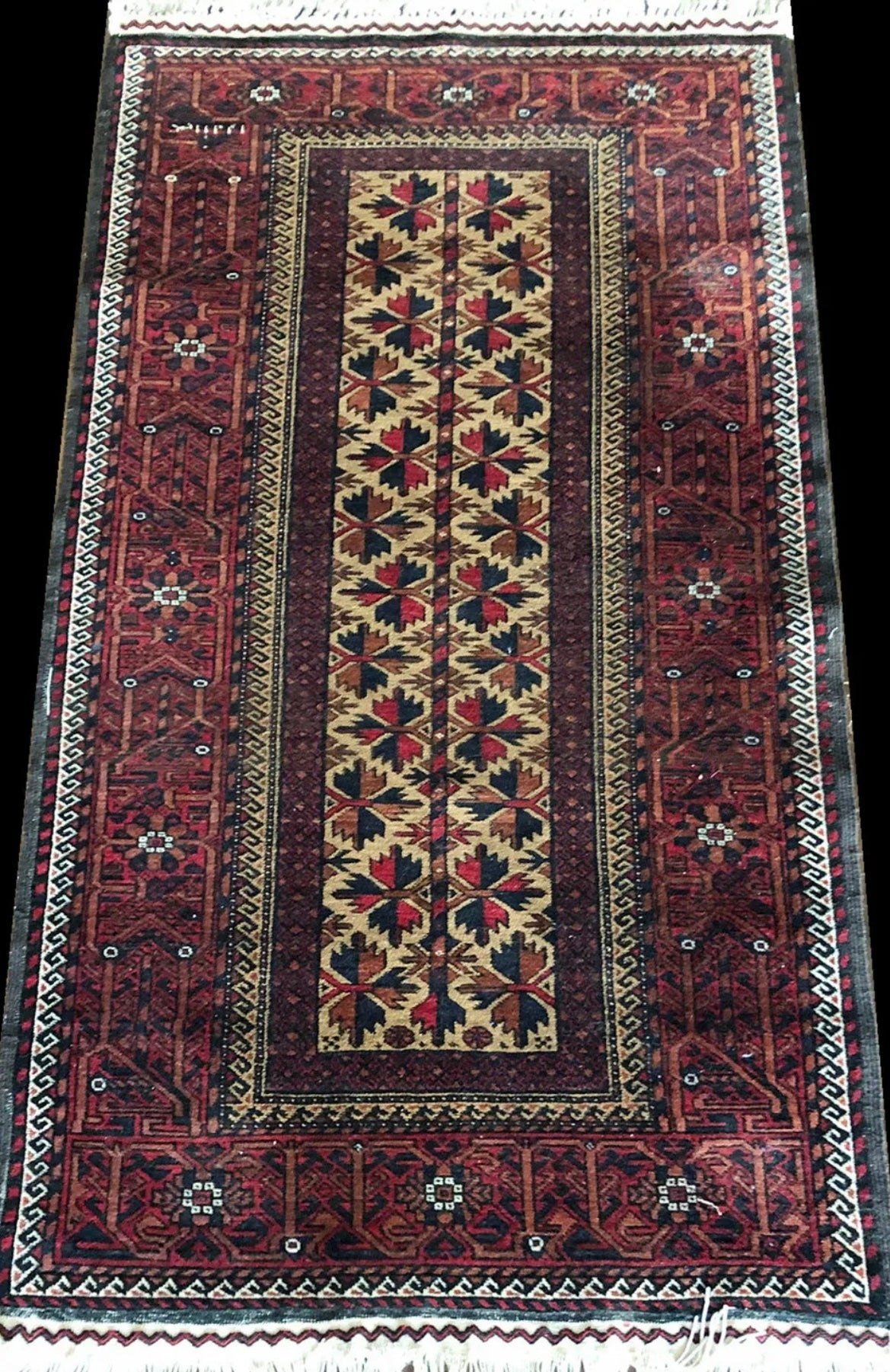 An Antique Primitive & Tribal Baluch Rug