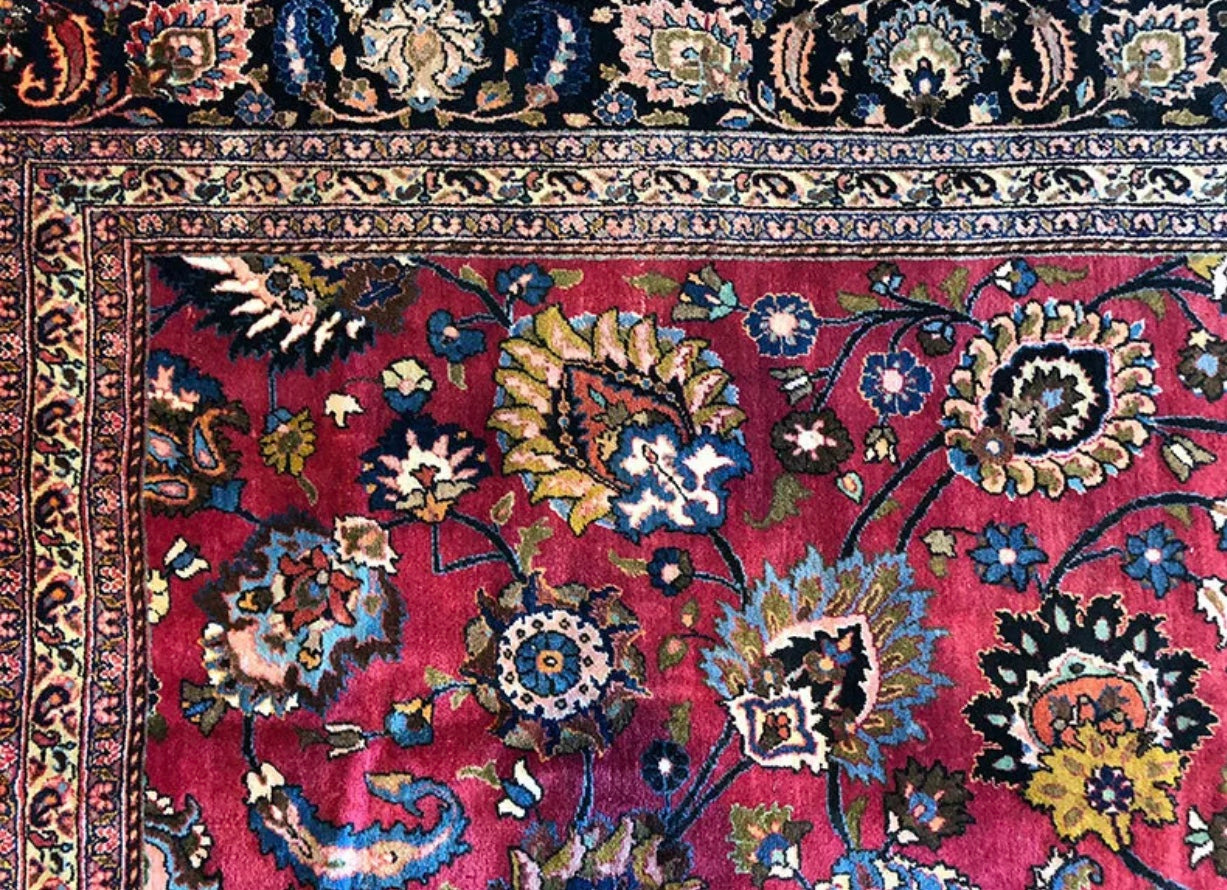 An Antique Palace Size Persian Mashad Rug