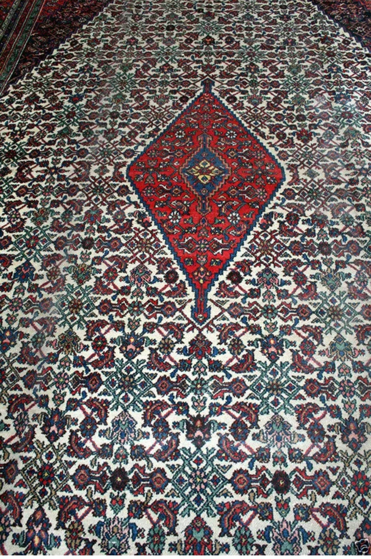 An Antique Palace Size 11’ x 19’ Persian Bibikabad Rug