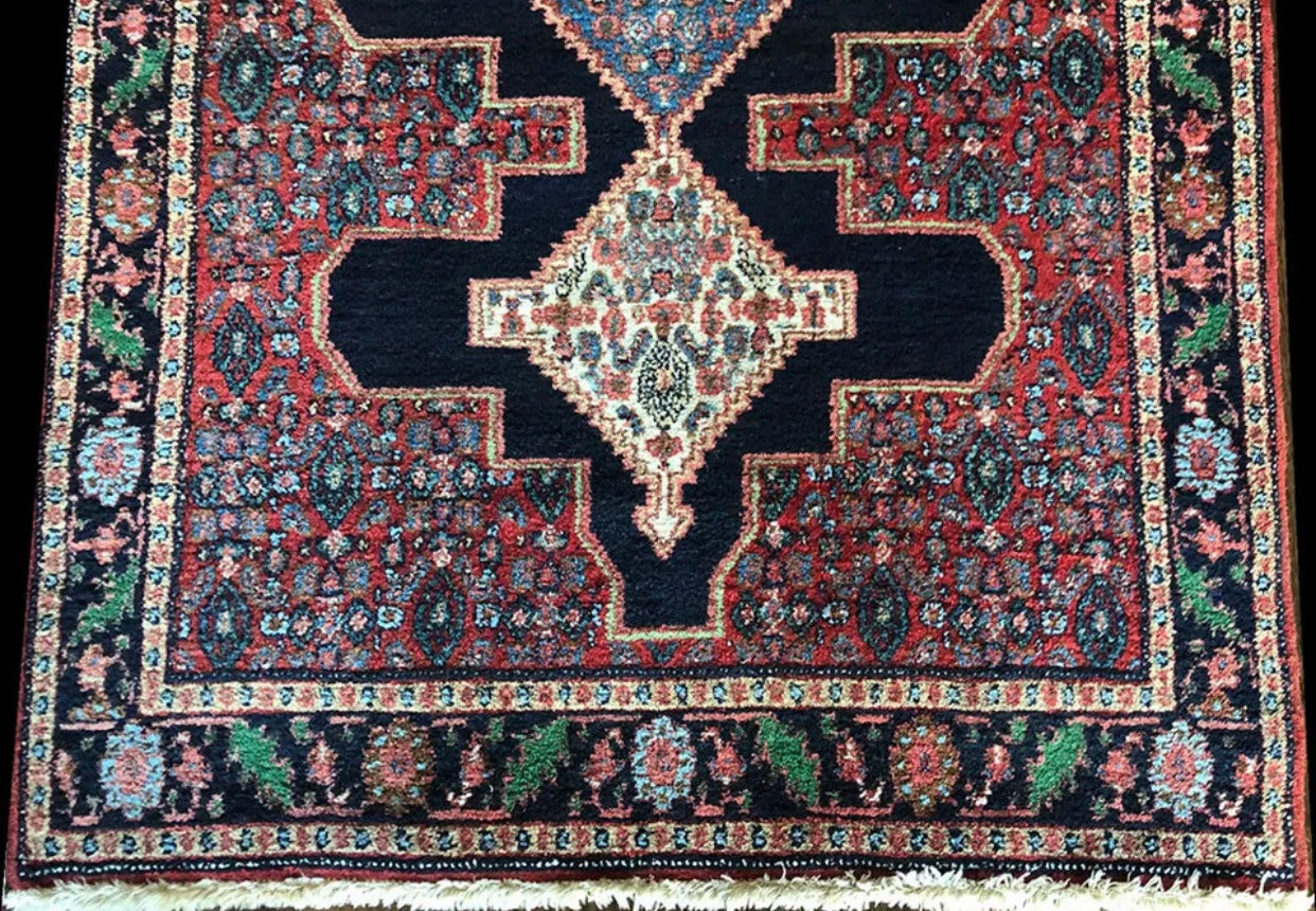 A Vintage Tribal Persian Seneh Rug