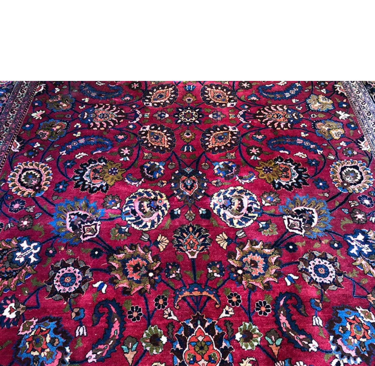 An Antique Palace Size Persian Mashad Rug