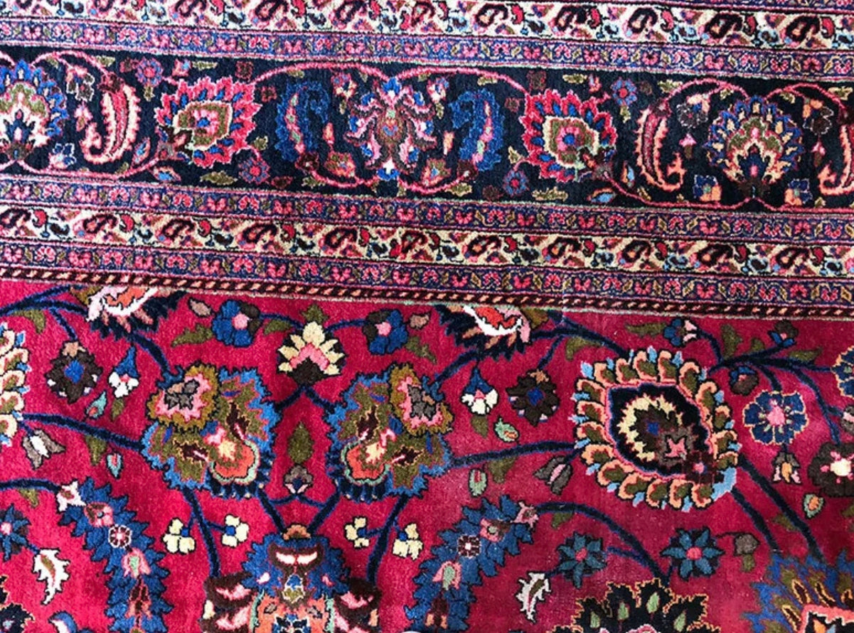 An Antique Palace Size Persian Mashad Rug