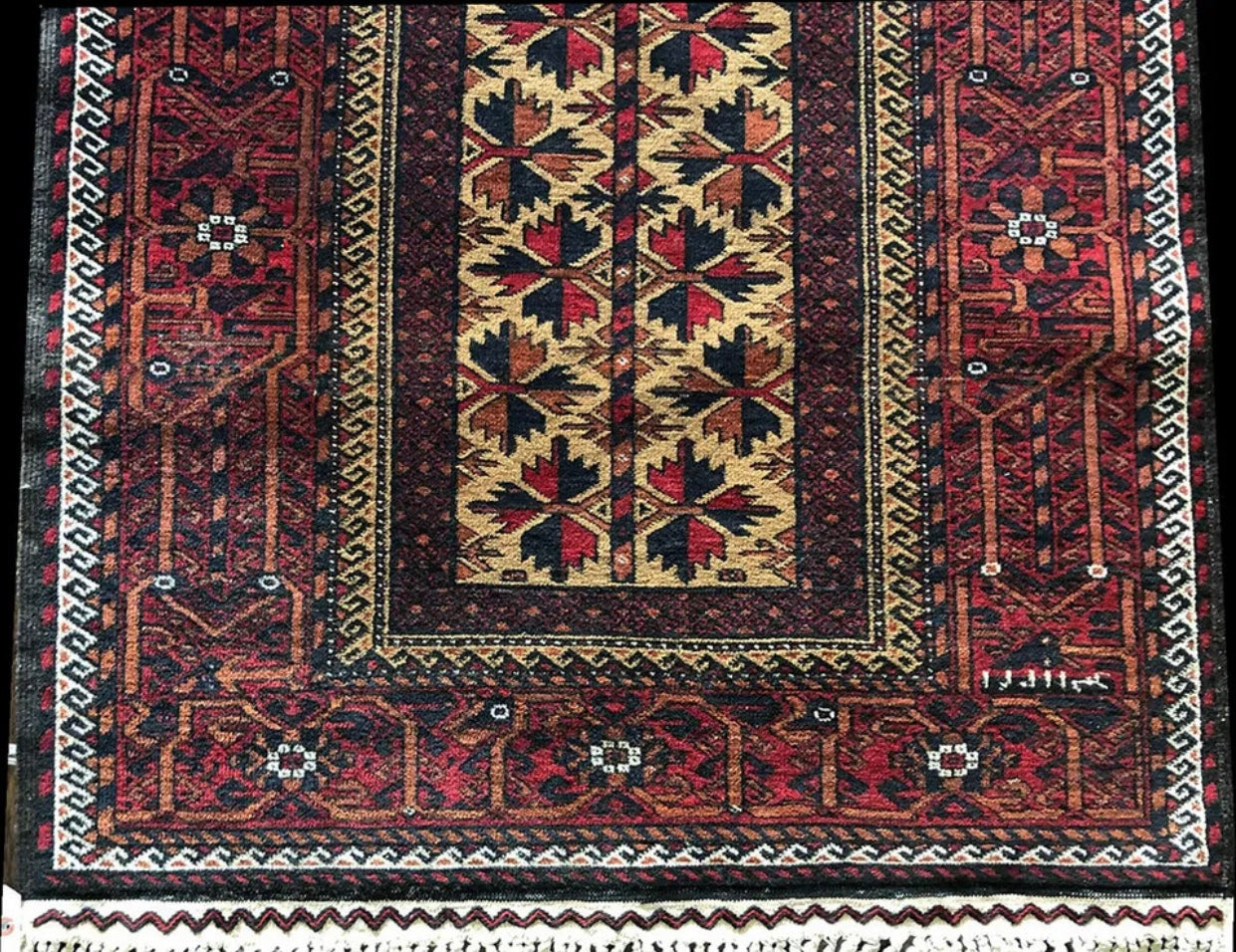 An Antique Primitive & Tribal Baluch Rug