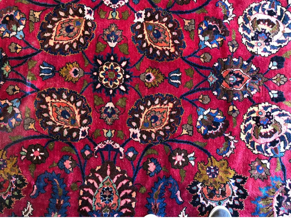 An Antique Palace Size Persian Mashad Rug