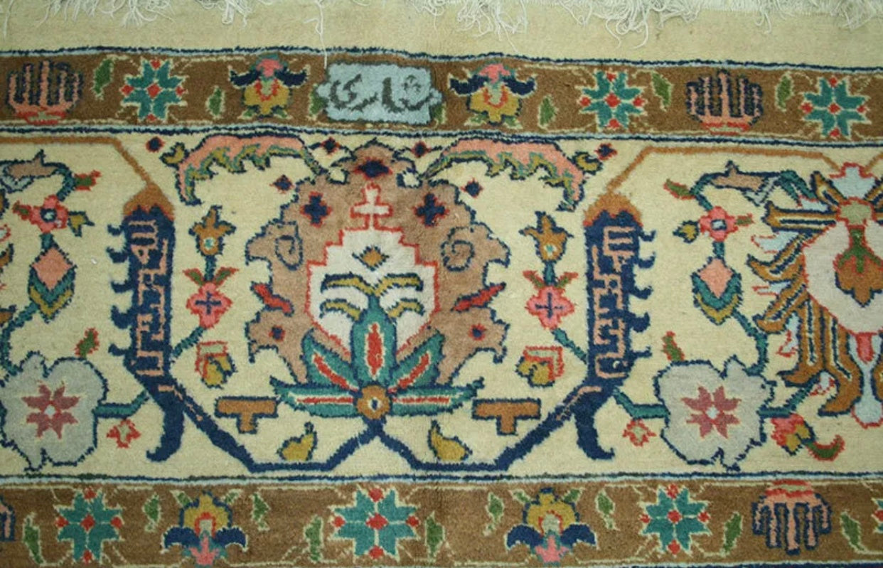 An Antique Signed Persian Tabriz rug