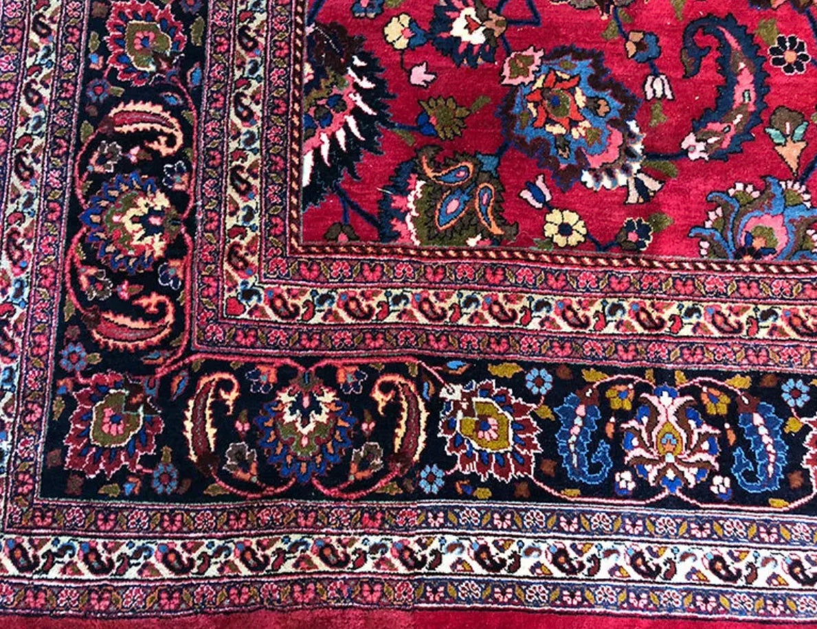 An Antique Palace Size Persian Mashad Rug