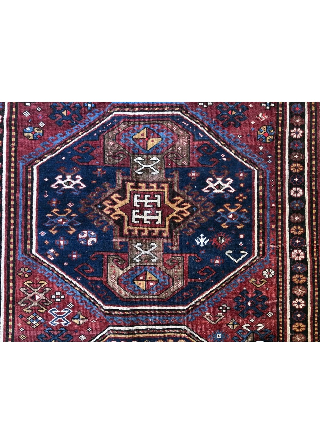 An Antique 3 Medallion Caucasian Kazak Rug