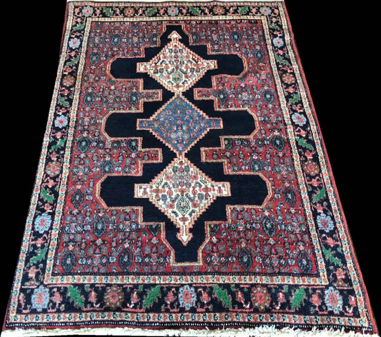 A Vintage Tribal Persian Seneh Rug