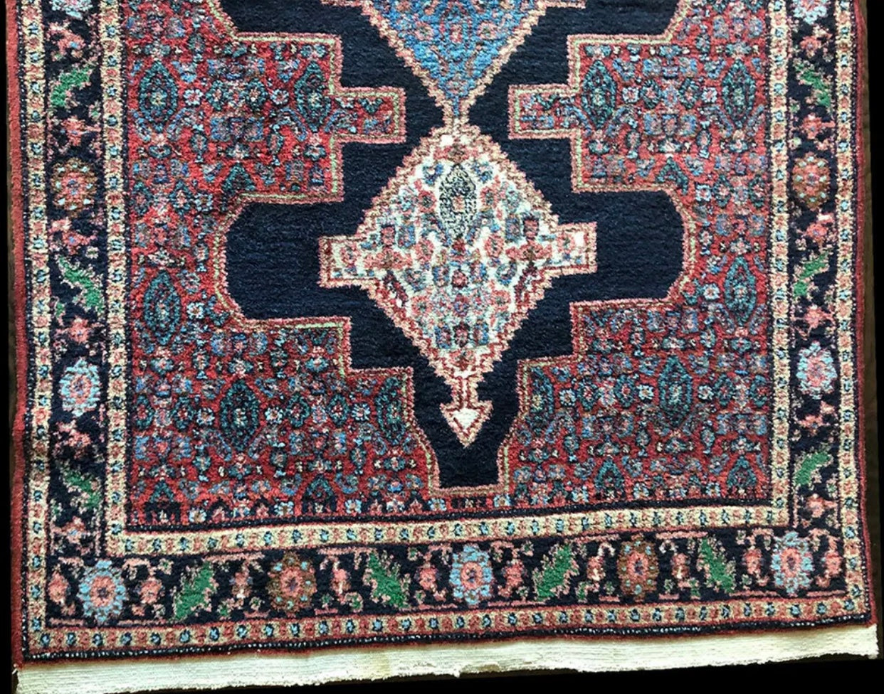 A Vintage Tribal Persian Seneh Rug