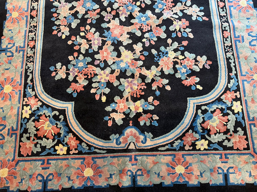 An Antique Black Bround 6'-4" x 9' Art Deco Chinese Rug