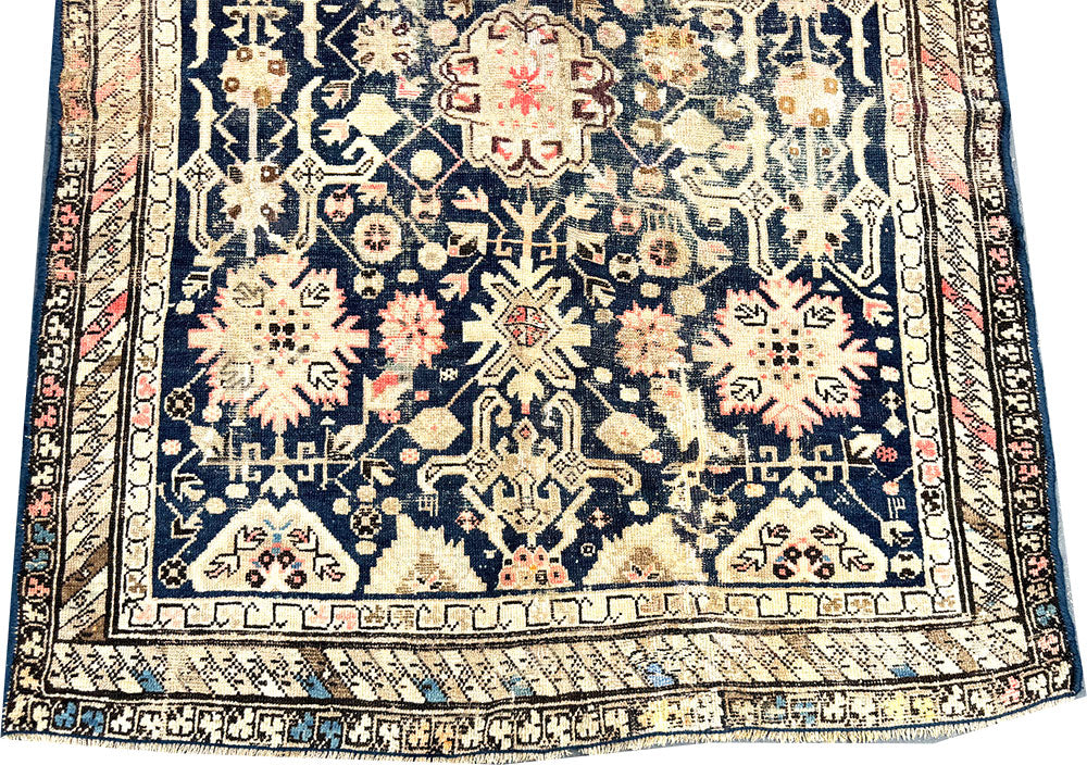 An Antique Decorative Blue Ground Worn Out Caucasian Rug