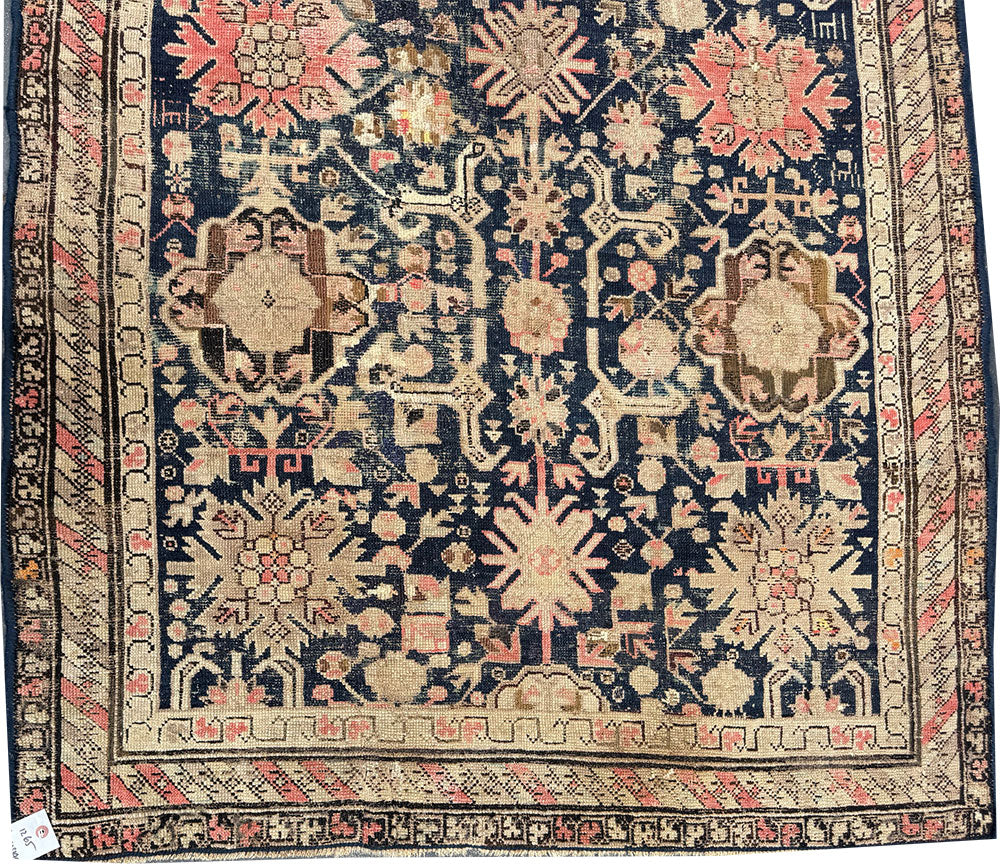 An Antique Decorative Blue Ground Worn Out Caucasian Rug
