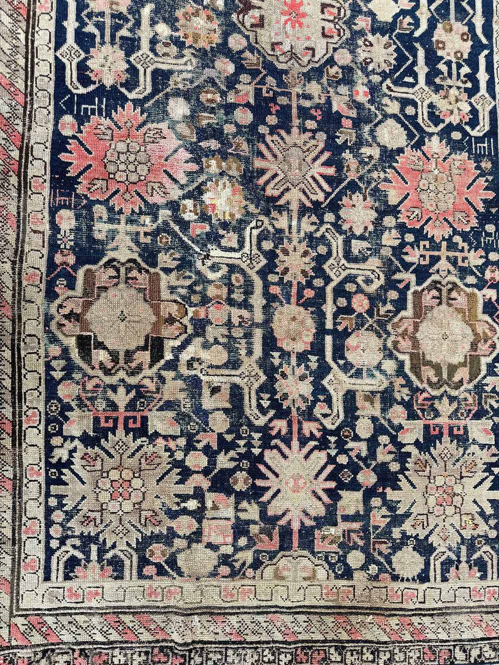 An Antique Decorative Blue Ground Worn Out Caucasian Rug