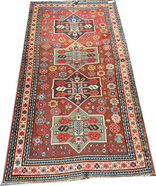 An Antique Decorative Geometric Tribal Caucasian Rug