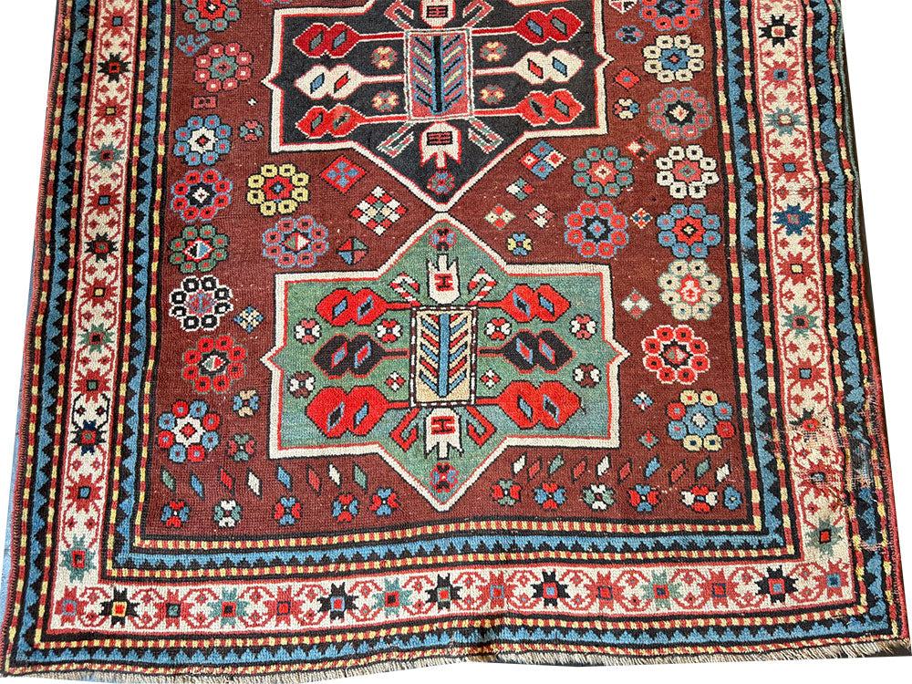 An Antique Decorative Geometric Tribal Caucasian Rug