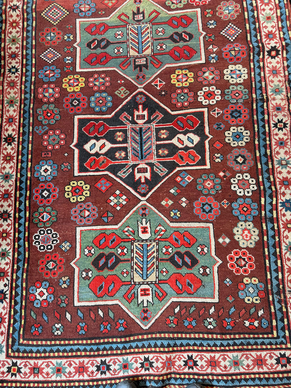 An Antique Decorative Geometric Tribal Caucasian Rug