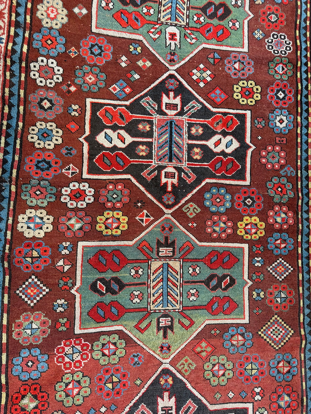 An Antique Decorative Geometric Tribal Caucasian Rug