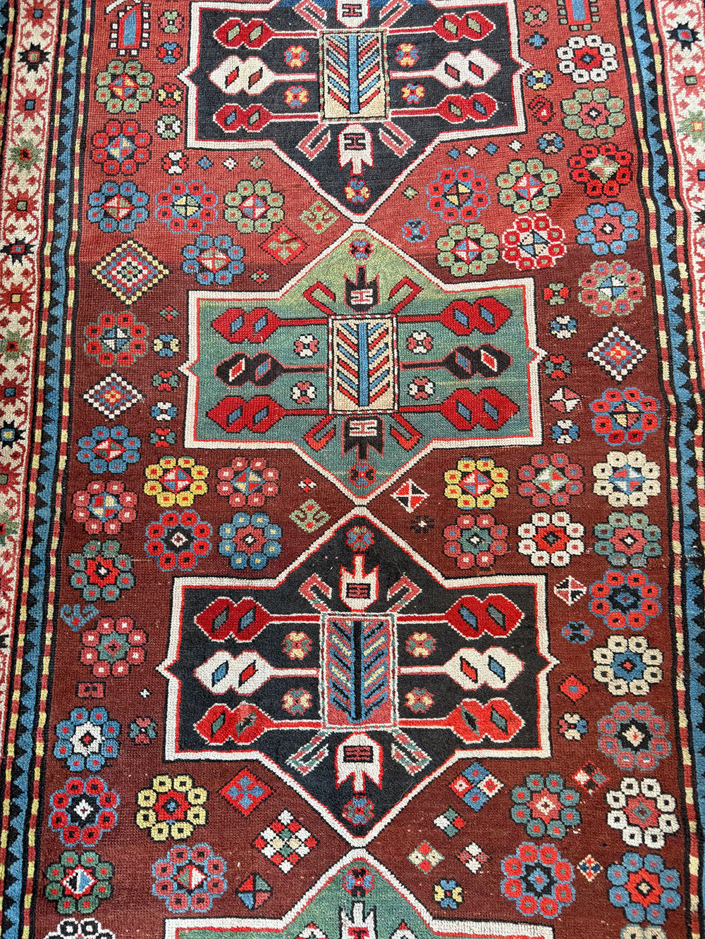 An Antique Decorative Geometric Tribal Caucasian Rug