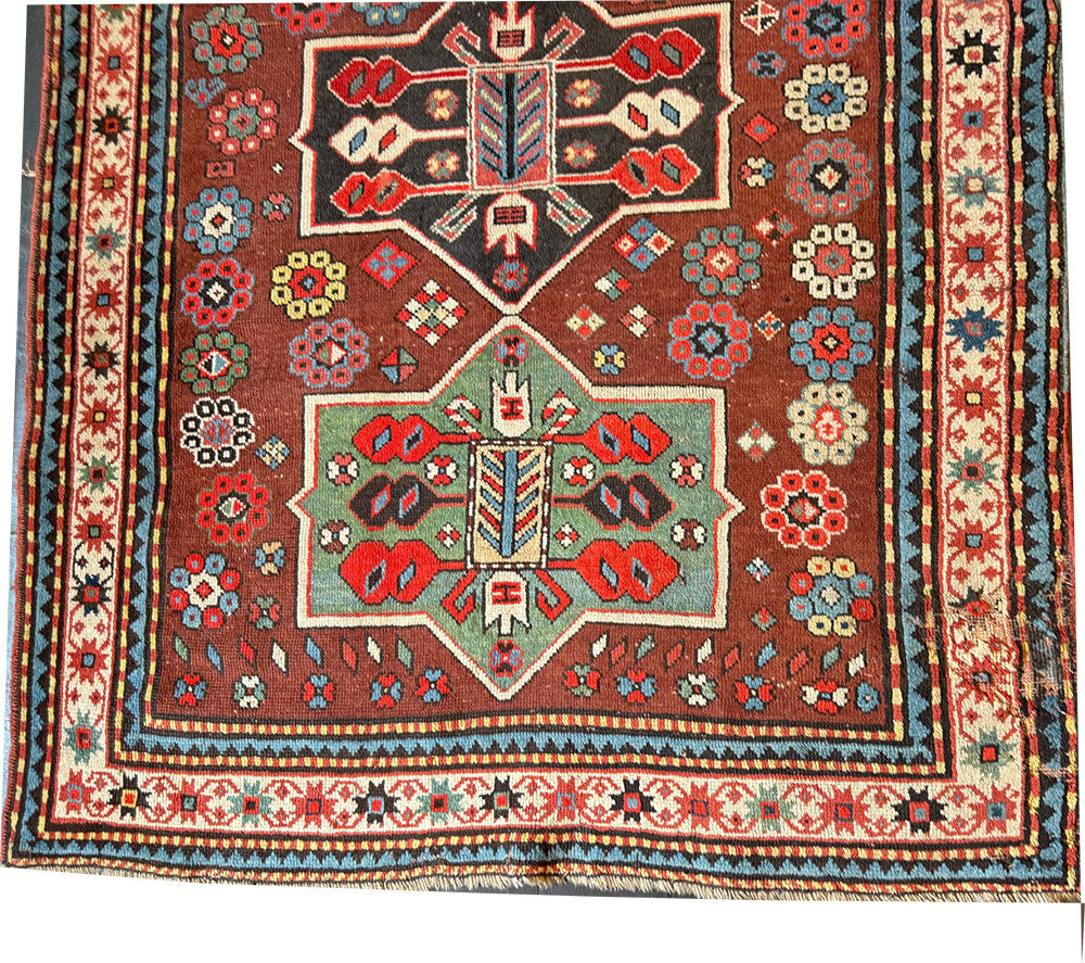 An Antique Decorative Geometric Tribal Caucasian Rug