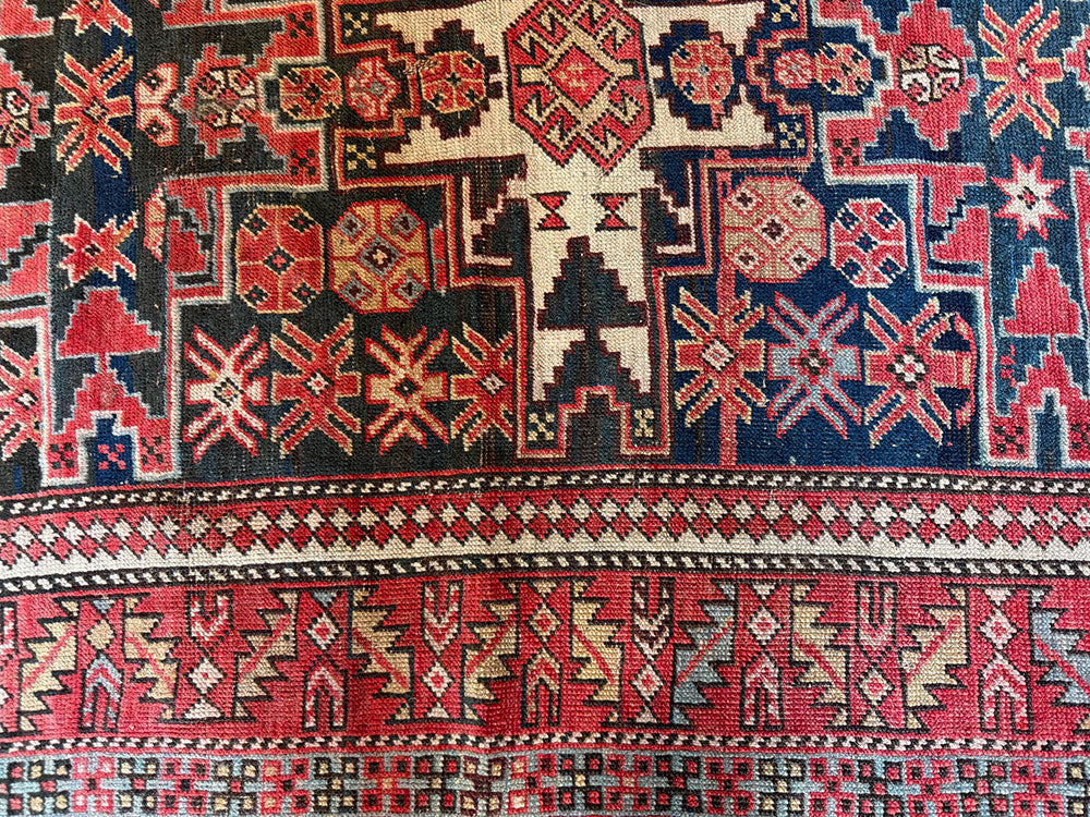 An Antique Caucasian Lesghi Star Area Rug