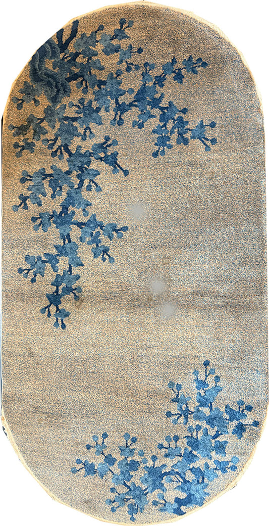 An antique Oval 3' x 6' Art Deco Chinese Rug