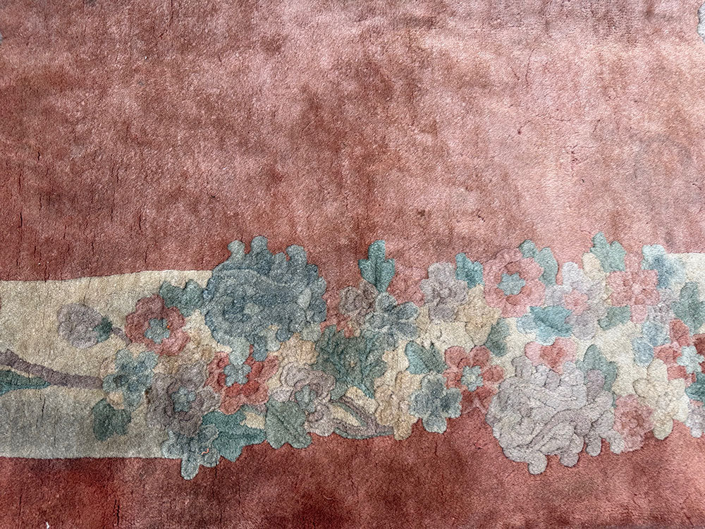 An antique Oval 3' x 6' Art Deco Chinese Rug