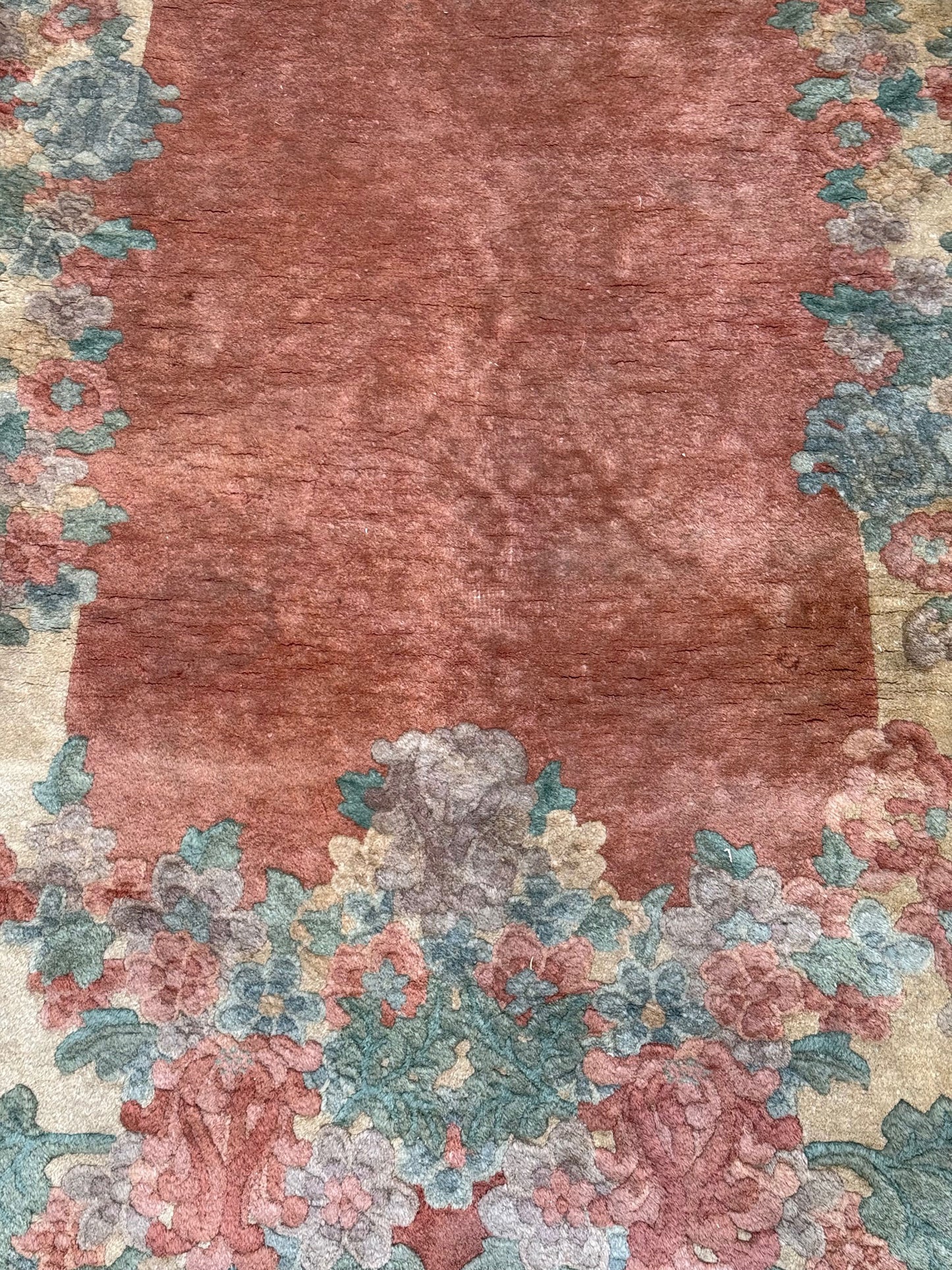 An antique Oval 3' x 6' Art Deco Chinese Rug