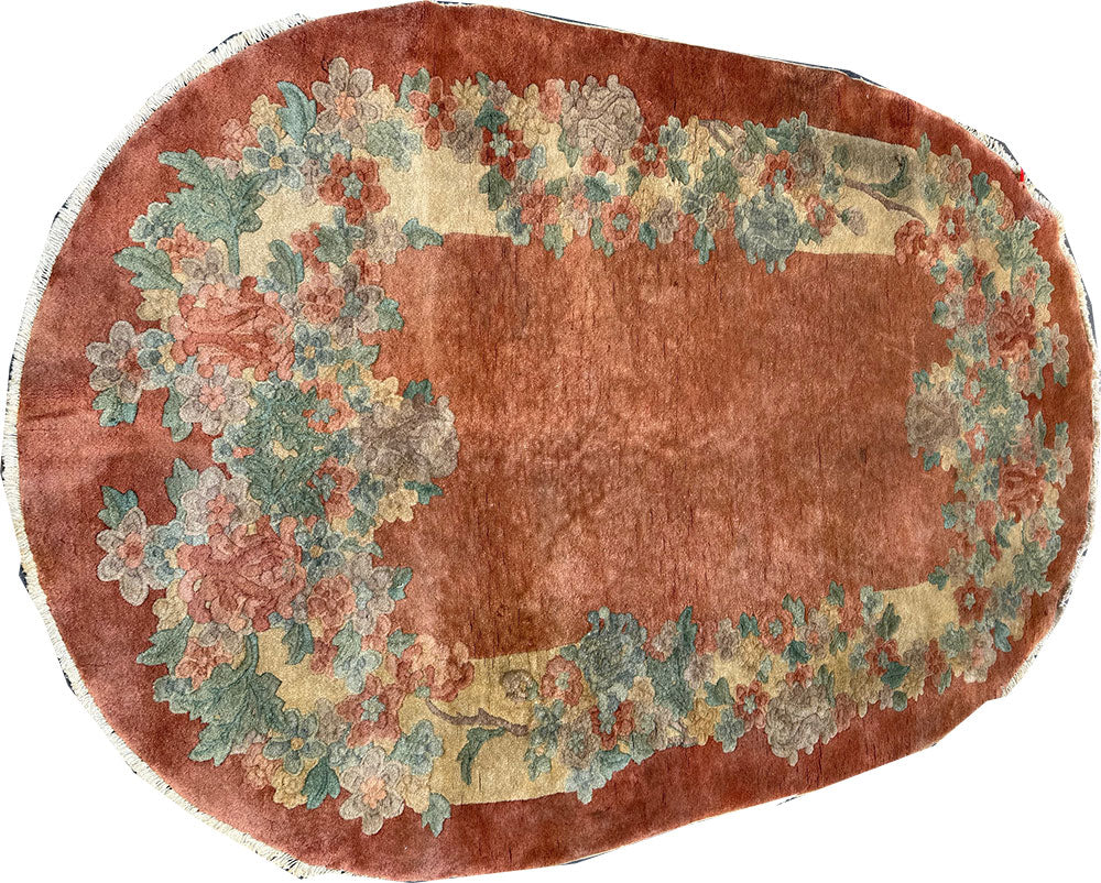 An antique Oval 3' x 6' Art Deco Chinese Rug