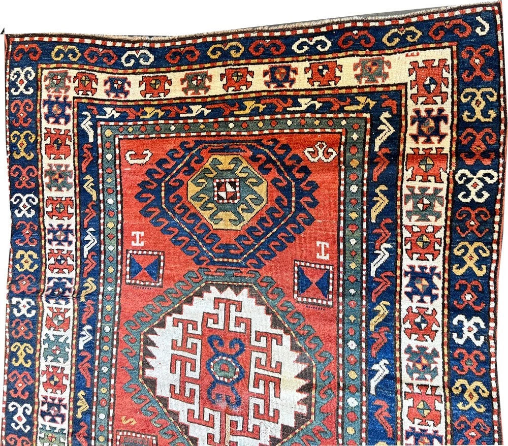 An Antique 3 Medallion Caucasian Kazak Rug
