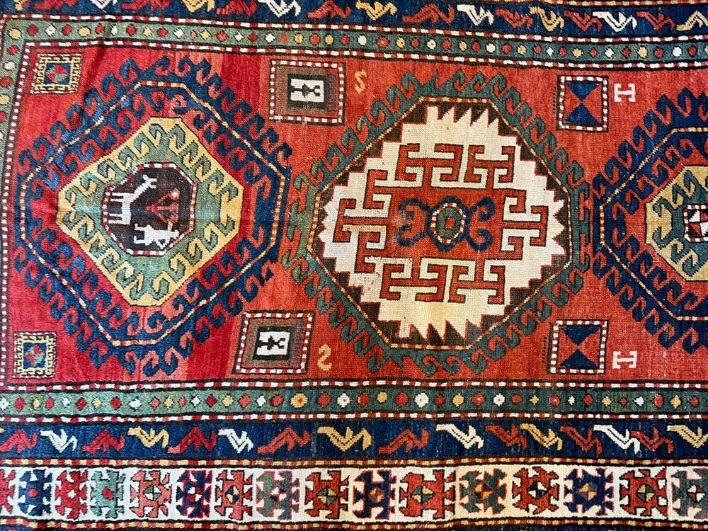 An Antique 3 Medallion Caucasian Kazak Rug