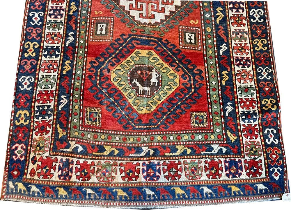 An Antique 3 Medallion Caucasian Kazak Rug