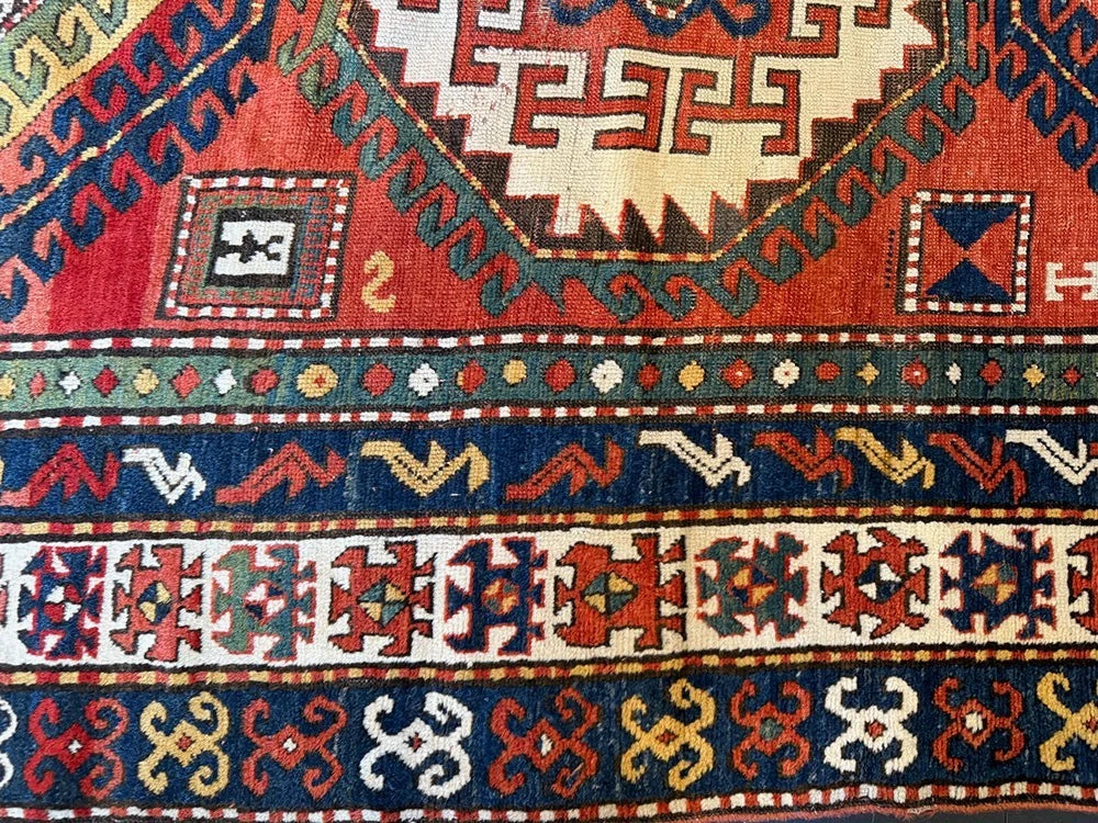 An Antique 3 Medallion Caucasian Kazak Rug