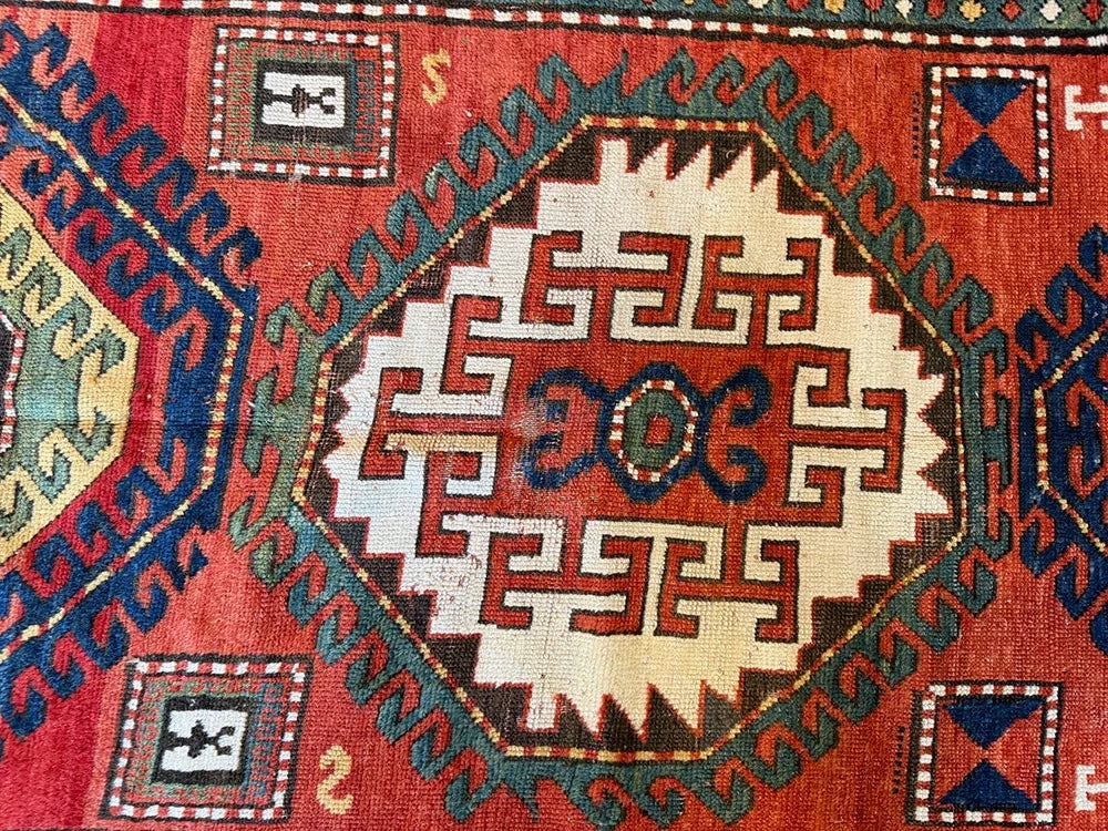 An Antique 3 Medallion Caucasian Kazak Rug