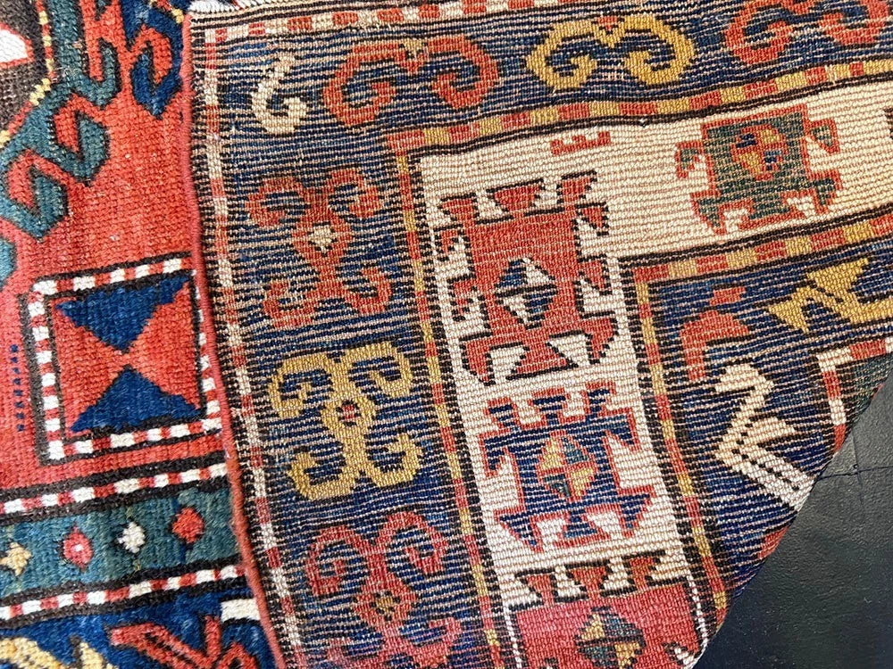 An Antique 3 Medallion Caucasian Kazak Rug