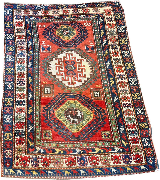 An Antique 3 Medallion Caucasian Kazak Rug