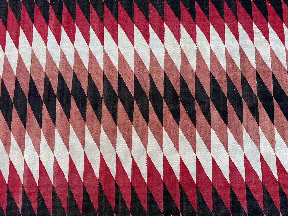 An Antique American Indian Eye Dazzle Navajo Flat Weavw Rug