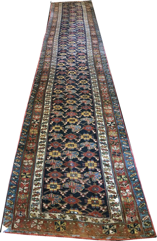 An Antique 17' Long NW Persian Hallway Runner Rug