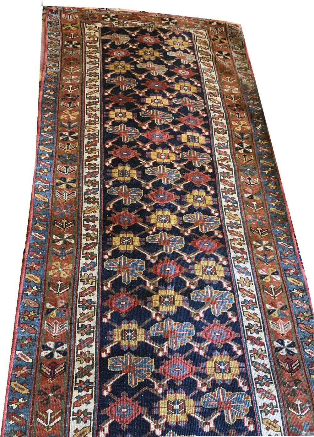 An Antique 17' Long NW Persian Hallway Runner Rug