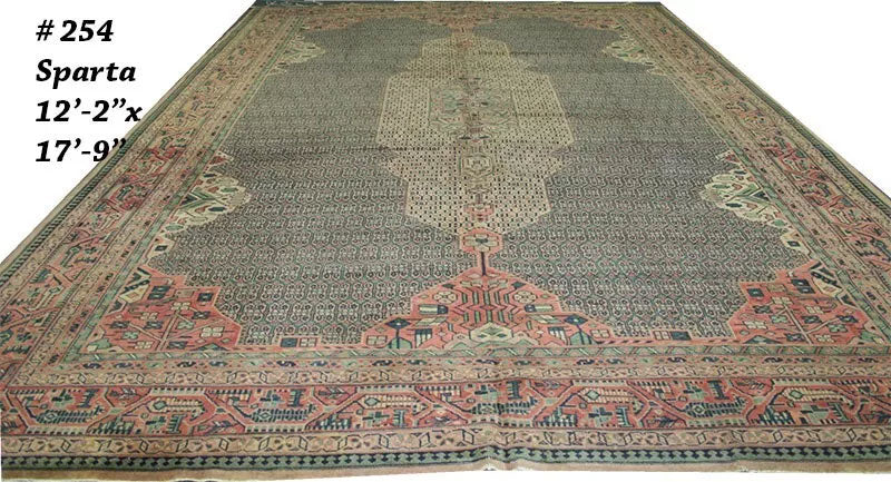 An Antique 12' x 18' Green Ground Turkish Sparta Rug