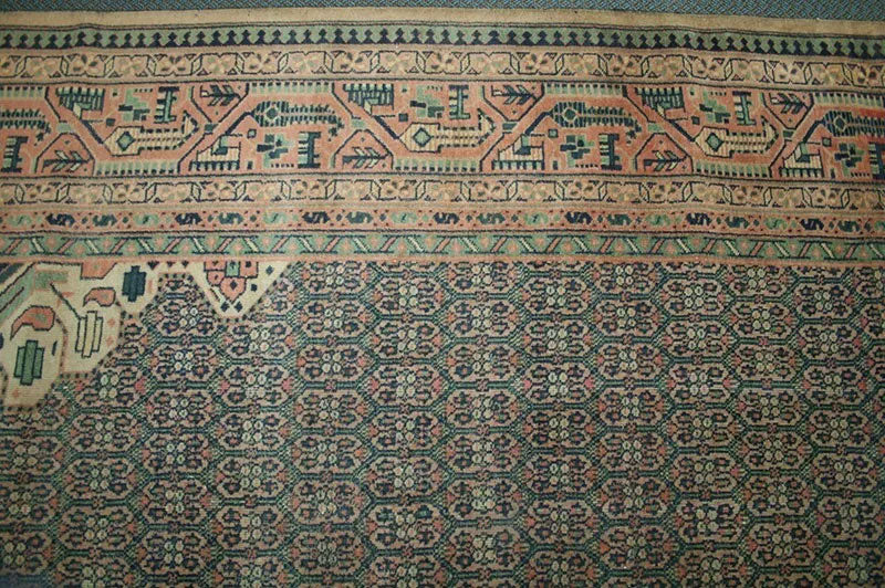 An Antique 12' x 18' Green Ground Turkish Sparta Rug