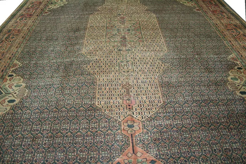 An Antique 12' x 18' Green Ground Turkish Sparta Rug