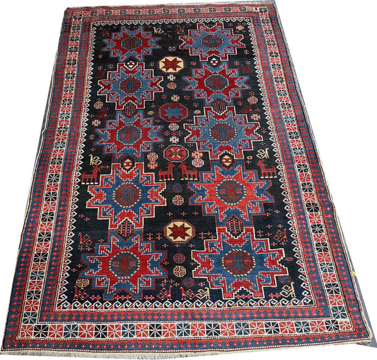 An Antique Decorative Blue Ground Caucasian Shirvan Rug