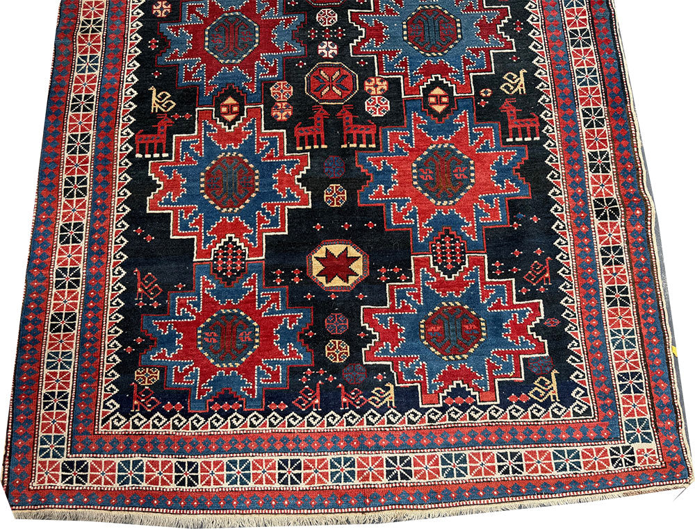 An Antique Decorative Blue Ground Caucasian Shirvan Rug