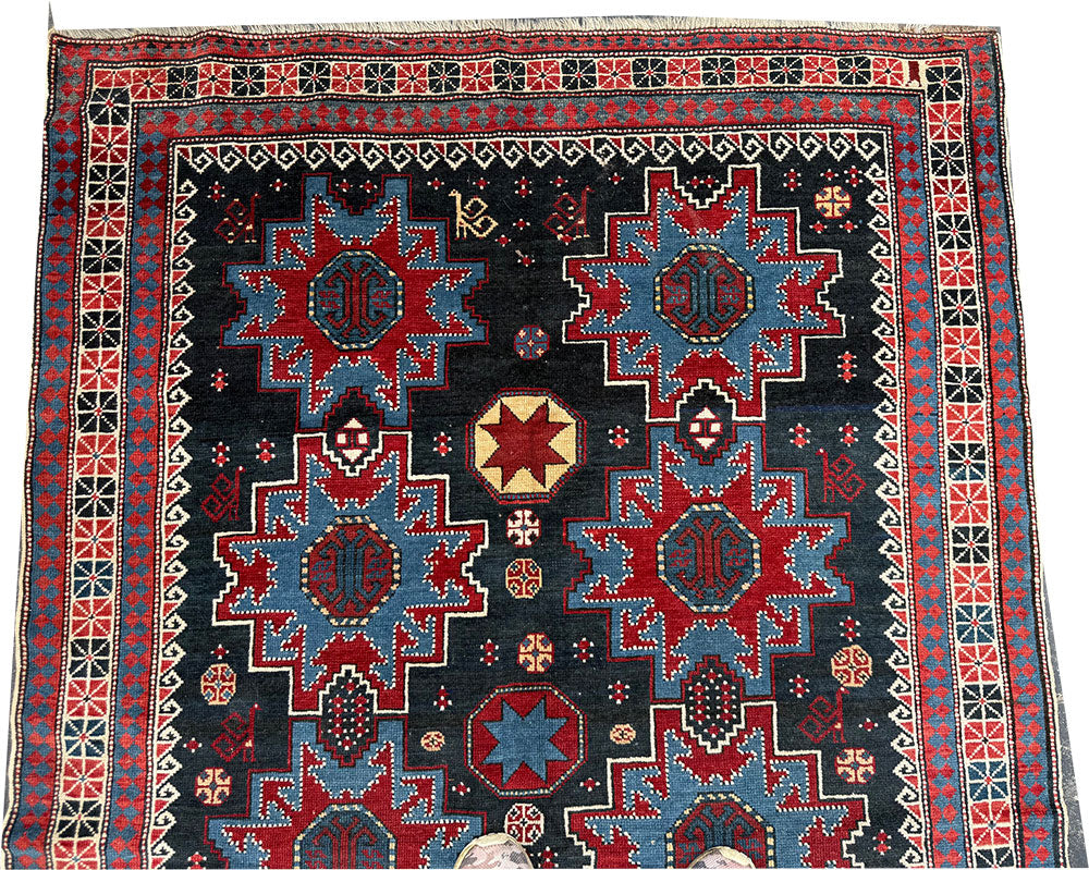 An Antique Decorative Blue Ground Caucasian Shirvan Rug